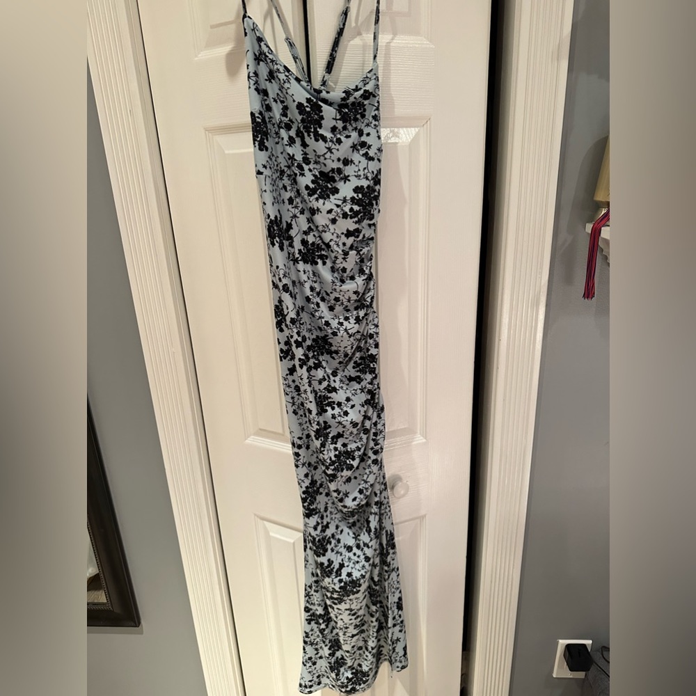 Long body on dress soft material slit in right leg cross cross back never worn